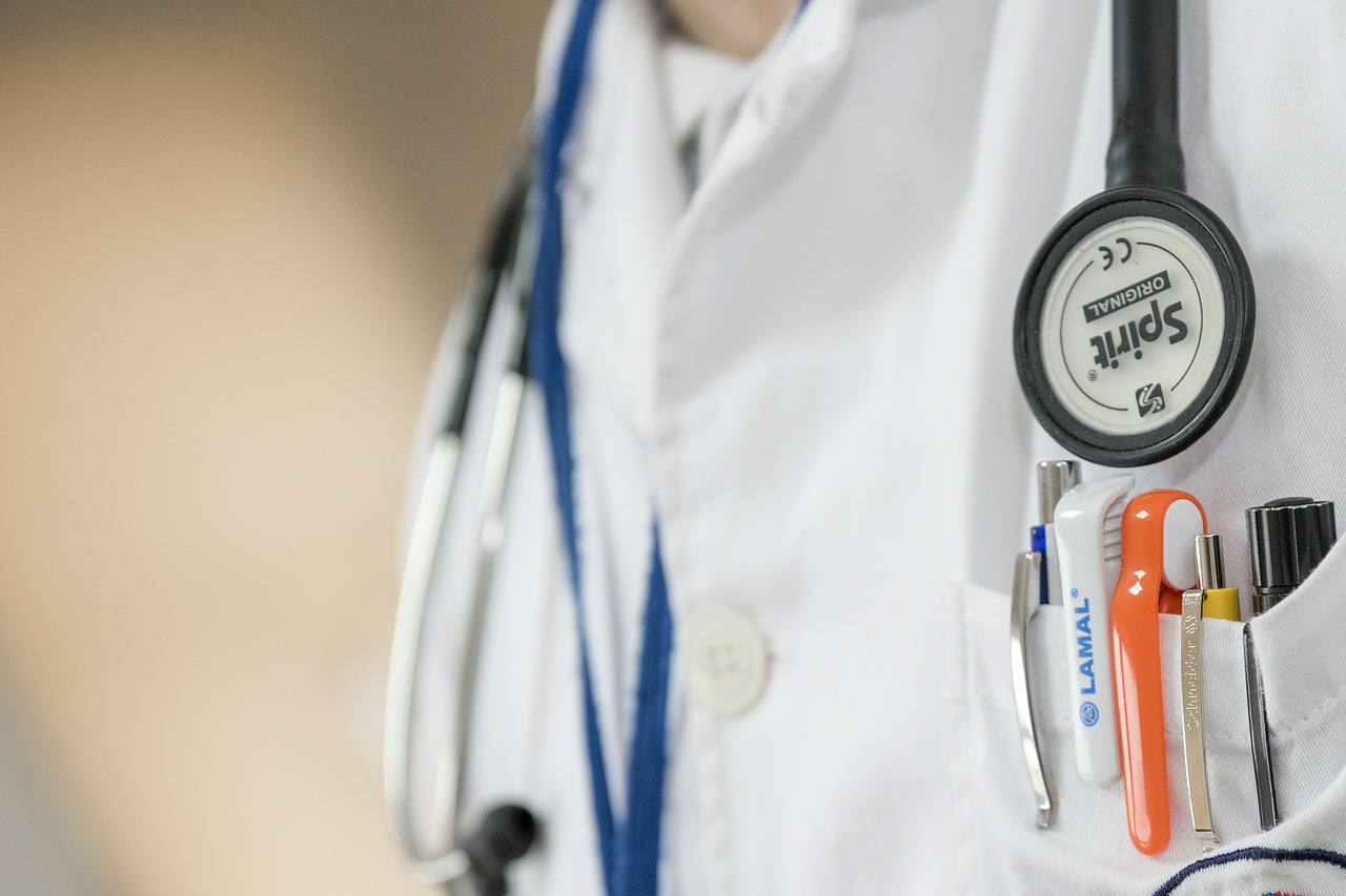 doctor lab coat with medical equipment 